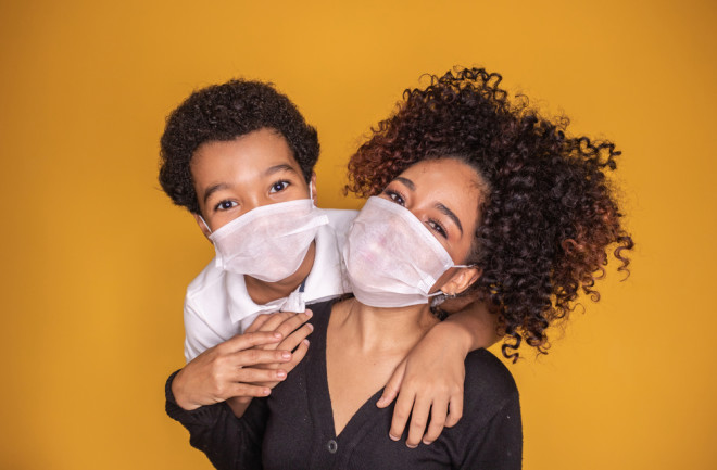 covid-19 coronavirus pandemic parent immunity mask - shutterstock