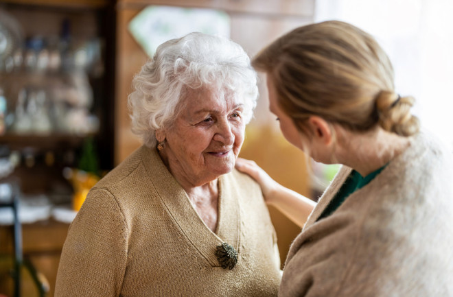 Health care worker talking to someone with dementia